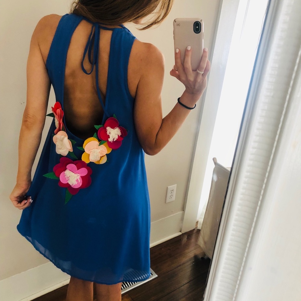 Adorable blue dress with flower appliqués!